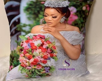 May include: A white pillowcase featuring a printed image of a bride holding a bouquet of pink, red and white flowers. The bride is wearing a white dress and a tiara. The text "STJDESIGNSSTORE" is printed in the bottom right corner of the pillowcase.