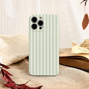 May include: A mint green and white striped phone case. The case has a vertical stripe pattern and is designed to fit a smartphone with multiple camera lenses. The case is shown on a neutral-toned surface.