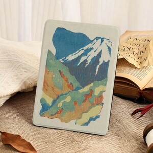 May include: A set of three ceramic mugs with a colourful, abstract design. Each mug features a unique pattern in shades of blue, green, and yellow. The mugs are displayed on a white surface.