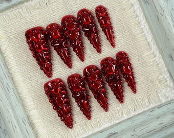 Almond Press On Fake Nails in Red with Gem Embellishments like Ruby and Sapphire, Glam Nail Art for Weddings, Parties and Formal Occasions