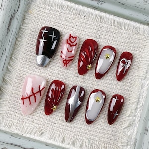 Chic Gothic Style Almond Press On Nail, Featuring Skull and Crossbones Motifs, Great for Gothic Themed Events and Gothic Aesthetic