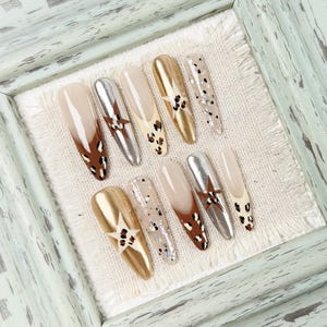Almond Press On Nails in Gold and Brown with Leopard Prints and Star Accents, Luxurious Glam Look for Weddings, Galas and Fashion Events