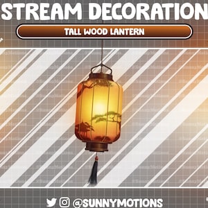 May include: A tall wood lantern with a warm, inviting glow. The lantern features a detailed landscape scene and a black tassel. The text "STREAM DECORATION" and "TALL WOOD LANTERN" are visible.