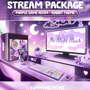 May include: A purple and white themed gaming room setup with a computer monitor displaying "Be Right Back", a gaming PC, a keyboard, a headset, a webcam, and a plush rabbit toy. The room is decorated with stars, clouds, and a crescent moon.