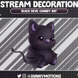 May include: A black plush bat with a devil tail and wings. The bat has a cute, cartoonish face with large eyes and a small mouth. The bat is sitting on a gray and white striped background. The text "BLACK DEVIL CHUBBY BAT" is displayed above the bat.