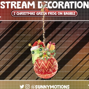 May include: A red Christmas ornament with a green frog wearing a Santa hat and holding a gift. The ornament is hanging from a gold chain against a red and black striped background. The text "STREAM DECORATION" and "2 CHRISTMAS GREEN FROG ON BAUBLE" is at the top of the image. The text "@SUNNYMOTIONS" is at the bottom of the image.