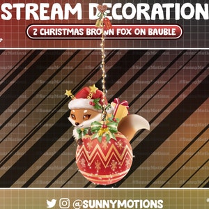 May include: A brown fox wearing a Santa hat and holding a gift is peeking out of a red and gold Christmas ornament. The ornament is hanging from a gold chain against a brown and black striped background. The text "STREAM DECORATION" and "2 CHRISTMAS BROWN FOX ON BAUBLE" is at the top of the image.
