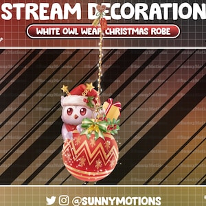 May include: A Christmas-themed digital graphic featuring a white owl wearing a Santa hat and scarf, peeking out of a red and gold ornament. The ornament has a festive design and is adorned with a green bow and a small gift box. Text reads "STREAM DECORATION" and "WHITE OWL WEAR CHRISTMAS ROBE".