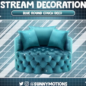 May include: A round, blue velvet couch with tufted buttons and a diamond pattern. The couch has three pillows, two of which are blue and one is white.