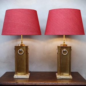 May include: A handmade, wooden serving tray with a natural finish. The tray features a rectangular shape with raised edges and two handles. The wood grain is visible, adding to its rustic charm. Dimensions: 18 inches long, 12 inches wide, and 2 inches high.