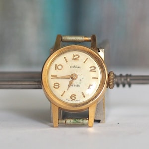 DELBANA 14K solid gold Swiss made mechanical wind up tiny