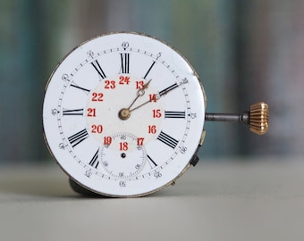 Movimiento de reloj de bolsillo mecánico de cuerda fabricado en Suiza de finales de 1800 - en funcionamiento