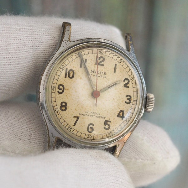 MILUS  Vintage Swiss made mechanical wind up  watch - start and stops, sold as not working, for spares or repair