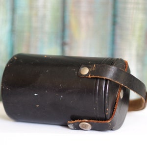 Vintage   leather container . Photo objective holder?