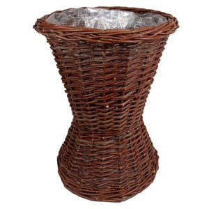 Wicker flower basket made of unbarked wicker with foil inside