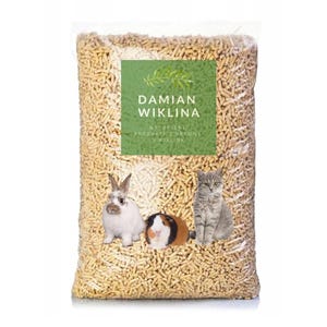 May include: A large bag of wood pellets for small animal bedding. The bag is labeled "Damian Wiklina" and says "Naturalny produkt z drewna wiklina". The bag is shown with a rabbit, a guinea pig, and a cat.