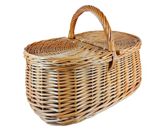 May include: A woven wicker picnic basket with a hinged lid and a brown handle.