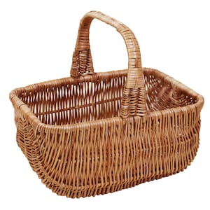 May include: A woven wicker basket with a handle. The basket is rectangular and has a light brown colour.