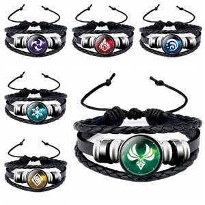 May include: Set of six black leather bracelets with different colored glass charms featuring various symbols. Each charm has a silver metal rim.