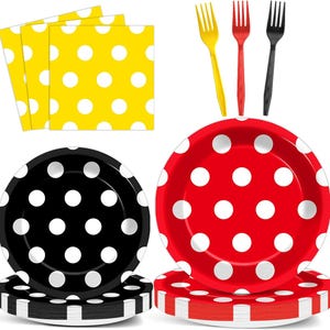 May include: A collection of party supplies featuring polka dots. Includes yellow napkins, black and red plates, and yellow, red, and black forks. The plates and napkins have white polka dots. The plates are stacked on top of matching paper plates.