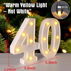 May include: White illuminated number 40 with warm yellow lights. The numbers are 8.5 inches tall, 5.9 inches wide, and 1.18 inches thick. The number 0 is 5.3 inches wide. The text "Warm Yellow Light - Not White" is at the top.