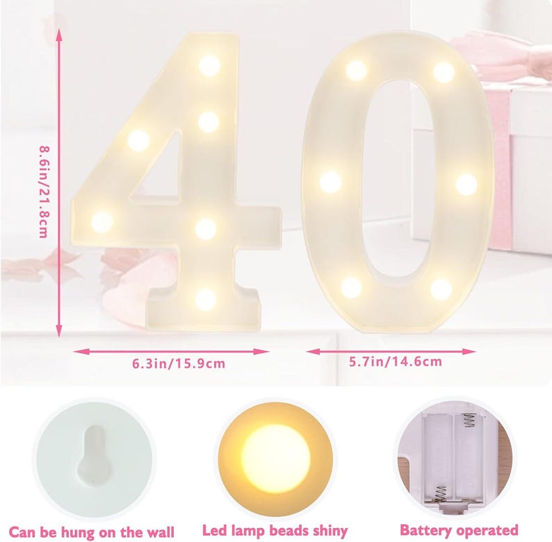 May include: White illuminated number 40 with warm LED lights. The numbers are 8.6 inches (21.8 cm) tall and can be hung on the wall. The number 4 is 6.3 inches (15.9 cm) wide, and the number 0 is 5.7 inches (14.6 cm) wide. Battery operated.