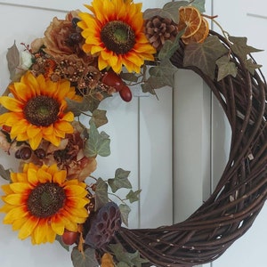 Handmade Decorative floral door wreath on a heavy woven wicker base