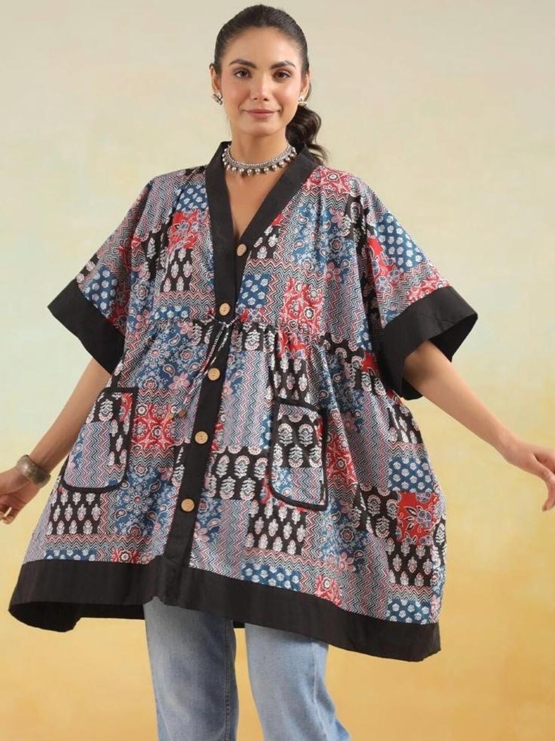 Cotton Hand block printed rust tunic with pleating and puff sleeves.