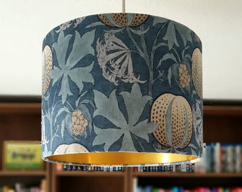 Drum lampshade Indigo/Blue fabric with brushed gold lining. Pumpkins by GP & J Baker is a fabric with a floral / botanical theme. 