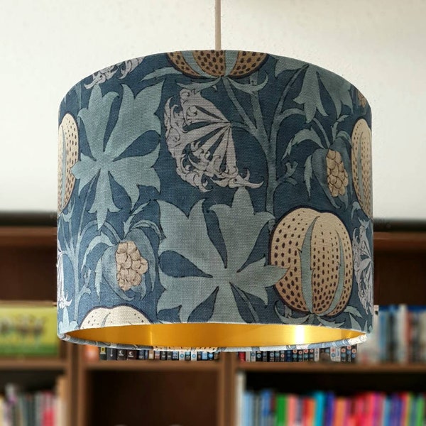 Drum lampshade Indigo/Blue fabric with brushed gold lining. Pumpkins by GP & J Baker is a fabric with a floral / botanical theme. 