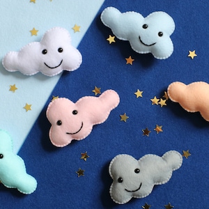 Cloud fridge magnet. Cute smiling clouds. Pastel home decor.