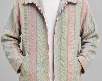 May include: A long-sleeve jacket featuring a multi-colored herringbone pattern in shades of soft pink, light green, and blue. The jacket has a wide collar with a red and white striped trim along the edges, two front pockets, and a plain white t-shirt.