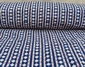 May include: A bolt of fabric featuring a repeating pattern of vertical blue stripes and white diamonds. The design includes thin, dashed red lines running vertically between the stripes, creating a structured, geometric look across the textile.