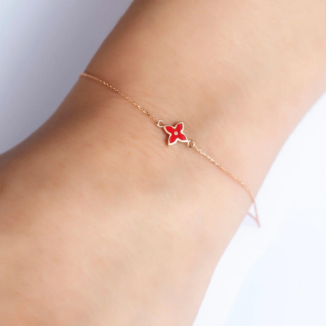 Beautiful Gold Bracelet with Black Flower. main image 1