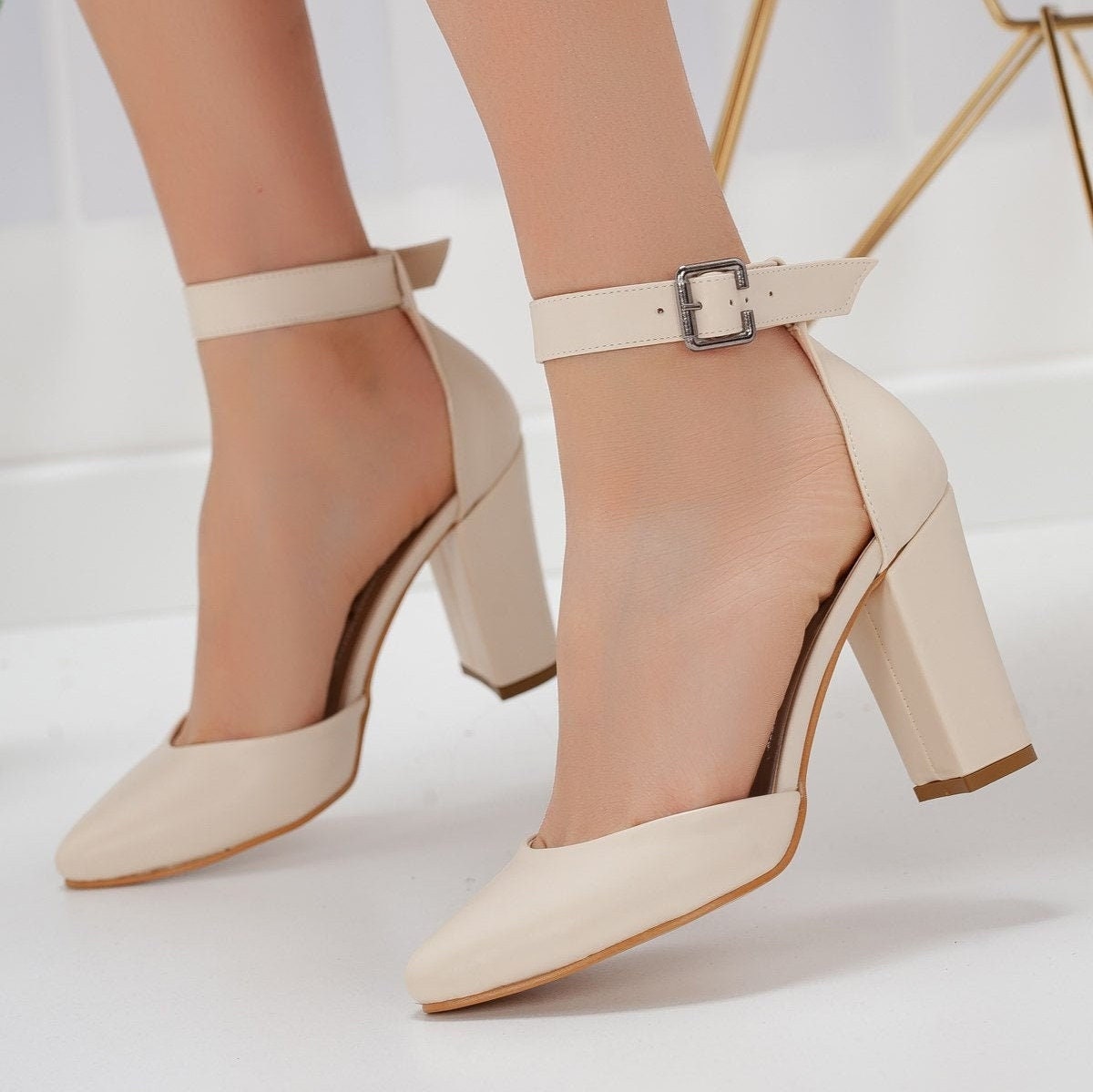 Beige sandals with a stable high heel and transparent straps around the  ankle - BRAVOMODA