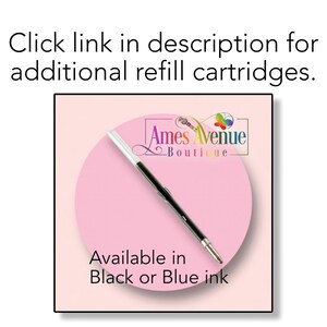 May include: A black and white pen with a clear plastic tip. The pen is on a pink background with the text "Ames Avenue Boutique" and "Available in Black or Blue ink".