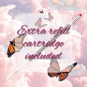 May include: A silver eyeliner pen with a pink cap and a butterfly design. The text "extra refill cartridge included" is written in pink on a white background.