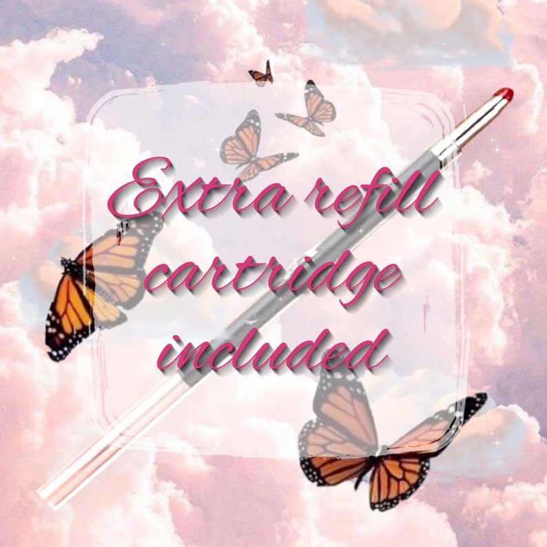 May include: A silver eyeliner pen with a pink cap and a butterfly design. The text "extra refill cartridge included" is written in pink on a white background.