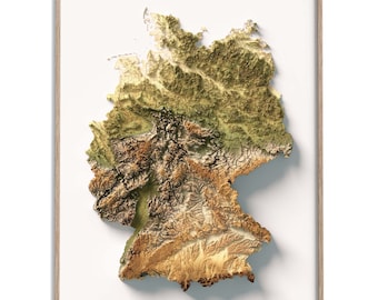May include: A 3D topographic map of Germany, showing the country's varied terrain in shades of green, brown, and yellow. The map is framed in a light wood frame.