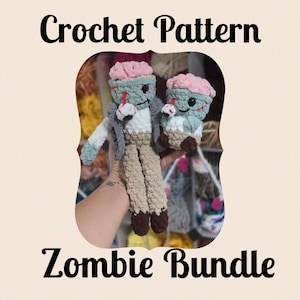 May include: Two handmade crochet zombie dolls featuring pink brains, light green skin, and dark brown feet. The larger doll wears a grey vest, while the smaller one is compact. Both have stitched facial details and a dangling eyeball accessory.