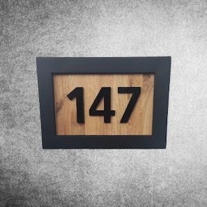 Wooden house number sign for the entrance - practical and decorative