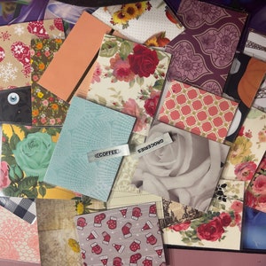 May include: A collection of various patterned card holders, featuring floral, geometric, and holiday designs. Some holders have the words "COFFEE" and "GROCERIES" on them. The color palette includes red, pink, blue, and green.