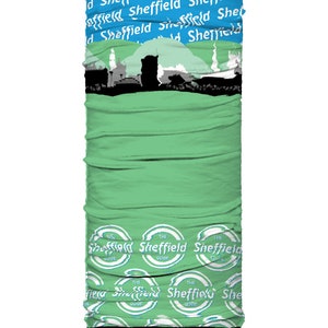 May include: A tubular neck gaiter with a green base, featuring a blue top section with the word "Sheffield" repeated. A black silhouette of a cityscape is in the middle. The bottom has repeating "The Sheffield Guide" logos.