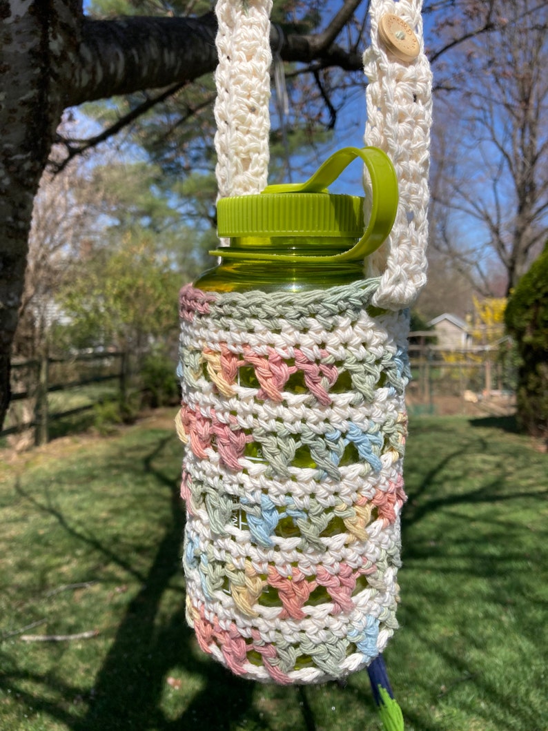Water bottle holder,handmade water bottle carrier,crochet water bottle holder,crossbody,adjustable strap,drink cozy,bottle holder w/ pocket. image 1