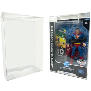 May include: A clear plastic display case with a DC Multiverse Superman action figure inside. The figure is wearing a blue and red suit with a red cape and is bound with a chain. The box has a blue and yellow DC logo and the text "McFarlane Collector Edition".