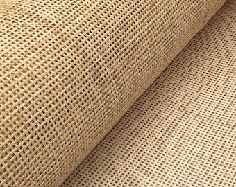 May include: A roll of natural cane webbing, a woven material often used for chair seats and other furniture upholstery.