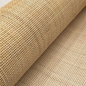 May include: A roll of natural cane webbing, a woven material often used for chair seats and other furniture upholstery.