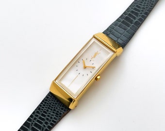 Vintage jaren 90 Yves Saint Laurent dames quartz horloge met grijze leren band en witte wijzerplaat