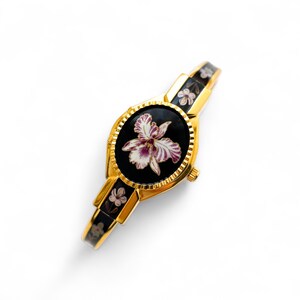 Vintage André Mouche Quartz Watch with Black and Purple Enamel Floral Design, Concealead Dial and Gold-Plated Bangle Bracelet