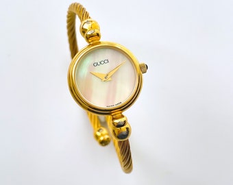 Vintage Ladies' Gold-Tone Gucci Bangle Quartz Watch with Mother of Pearl Dial